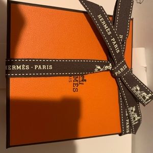 Brand new authentic Hermes box with authentic Hermes ribbon. Must have !